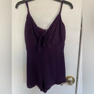 Purple jumpsuit. Perfect for any occasion. Never worn with tags on. Size M.